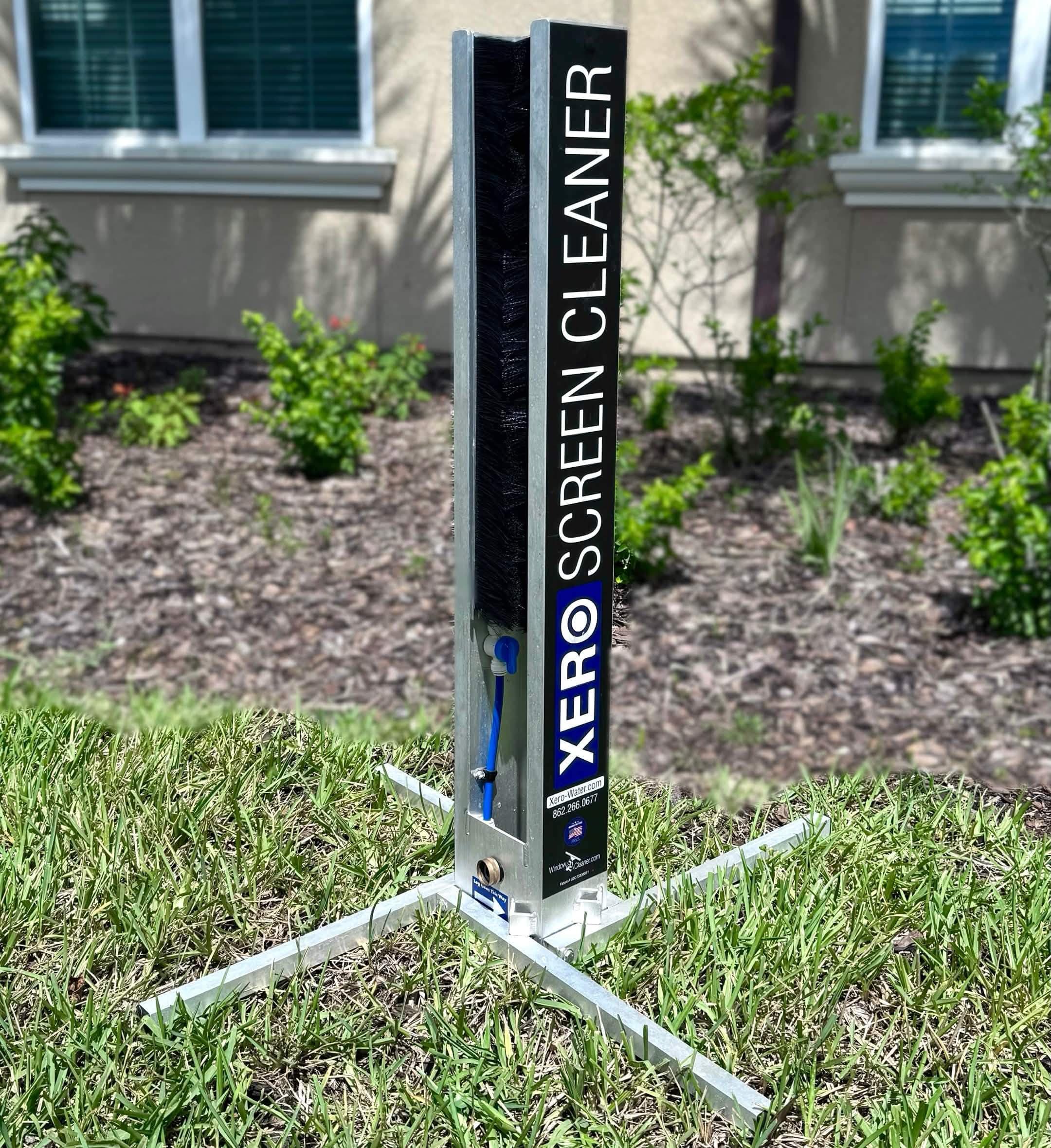 Xero screen cleaning station set up on a lawn for scrubbing window screens on site